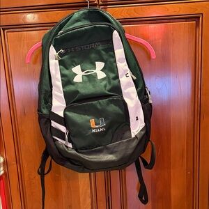 Under Armour Hustle 5.0 backpack in green with the University of Miami logo